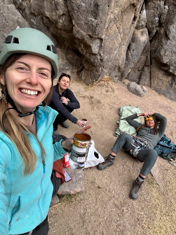 Portrait of women rock climbers taking a break outside.