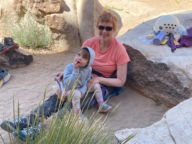 Woman and child taking a snack break at the crag.