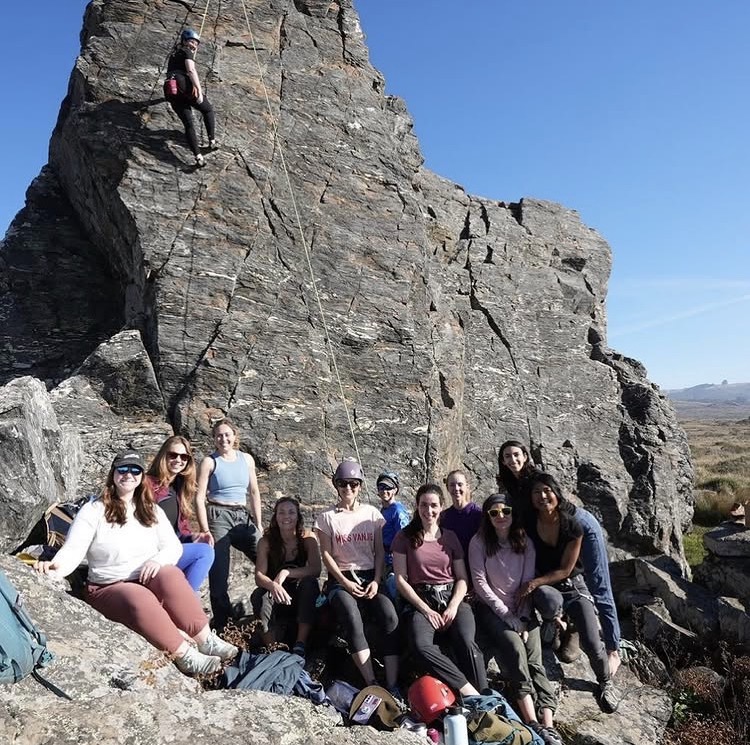 Group portrait of women rock climbers at the crag.