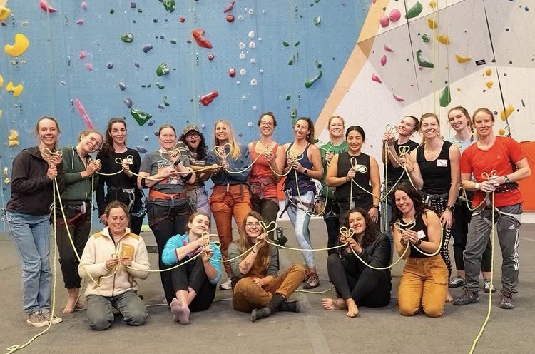 Group portrait of Women's Lead Club members at Session climbing gym.