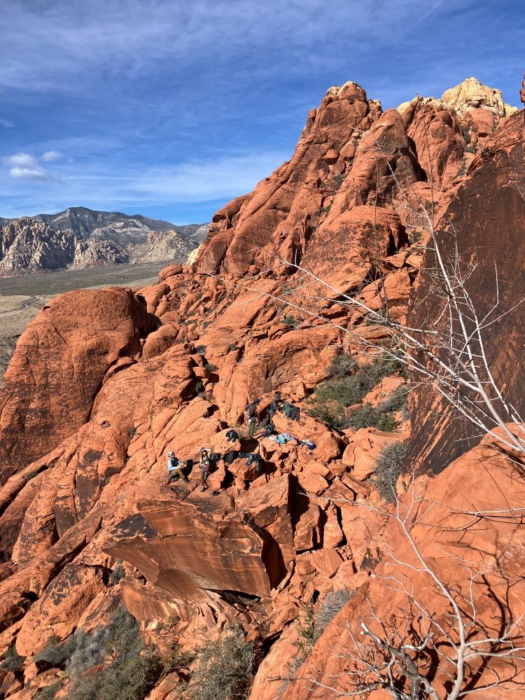 Group of rock climbers seen from above at Red Rocks crag.
